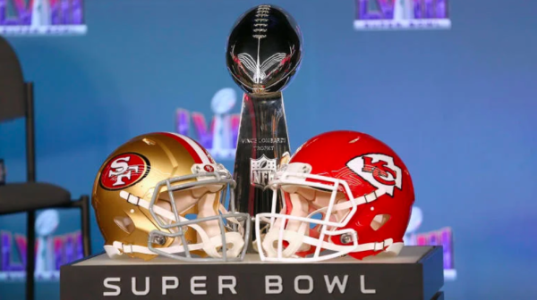 The 49er’s signature helmet (left), and the Chiefs helmet (right), placed directly in front of the Super Bowl trophy in preparation for Sunday night’s game.